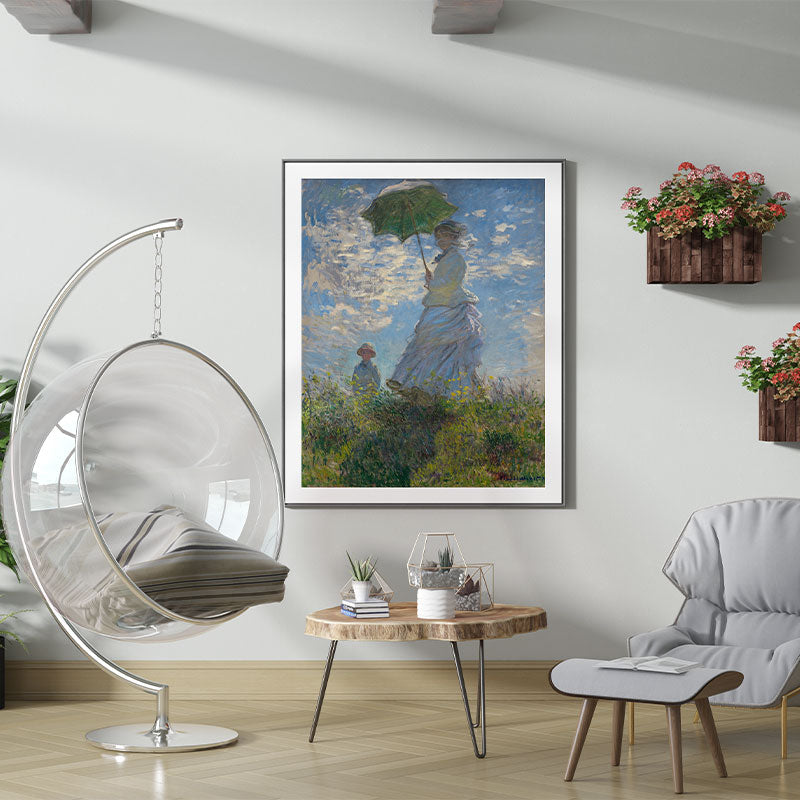 Quadro Decorativo Mulher com Sombrinha Pendurado em Parede Branca.