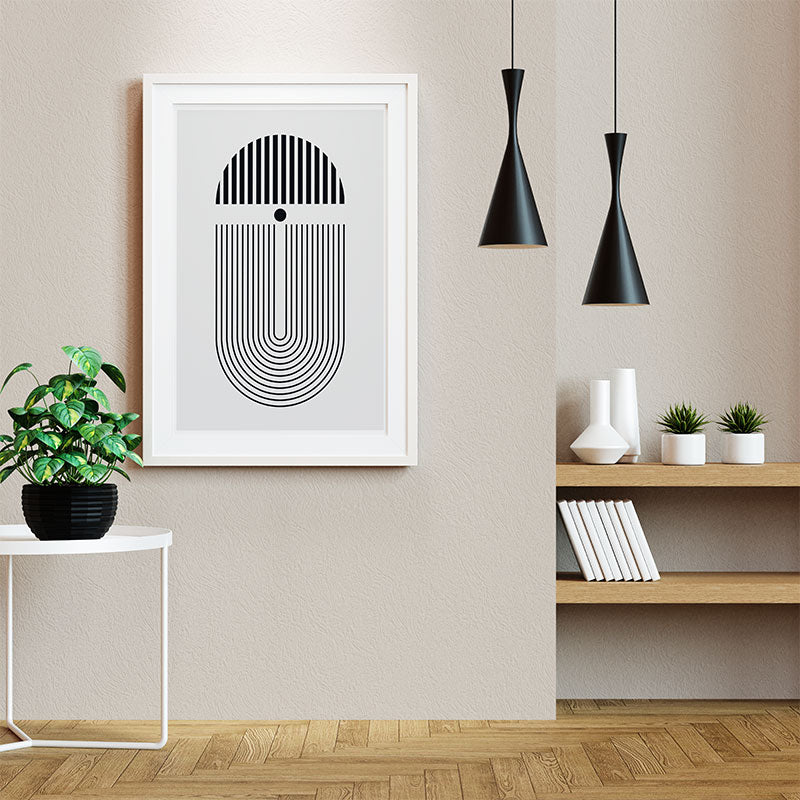 Quadro Minimalista Preto e Branco Pendurado ao Lado de Luminárias Pretas.